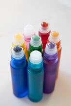 Load image into Gallery viewer, SO VIBRANT Blue bottle with clear quartz rollerball
