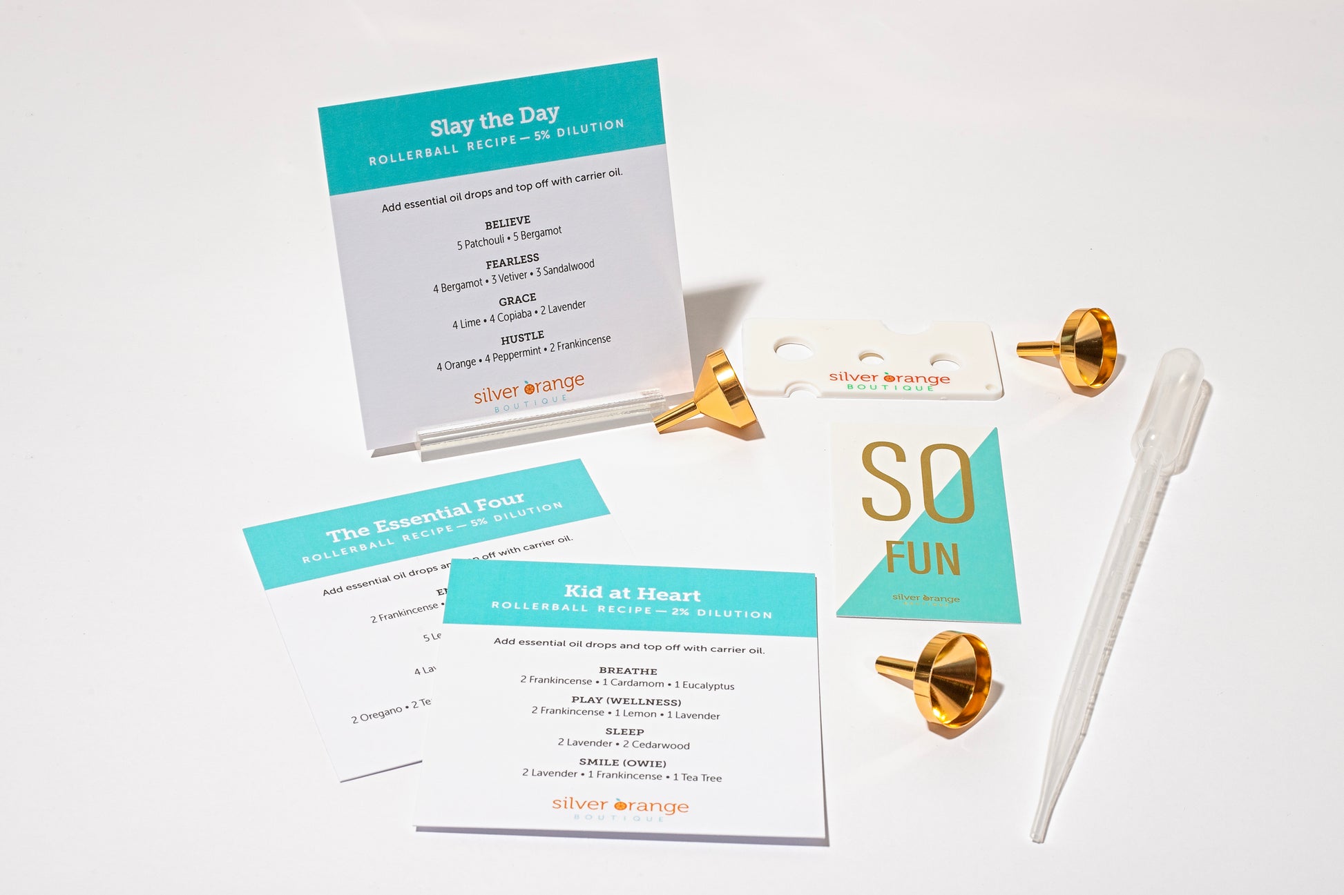 Recipe cards for essential oil blends with pipette, funnels, eo key  and card holder